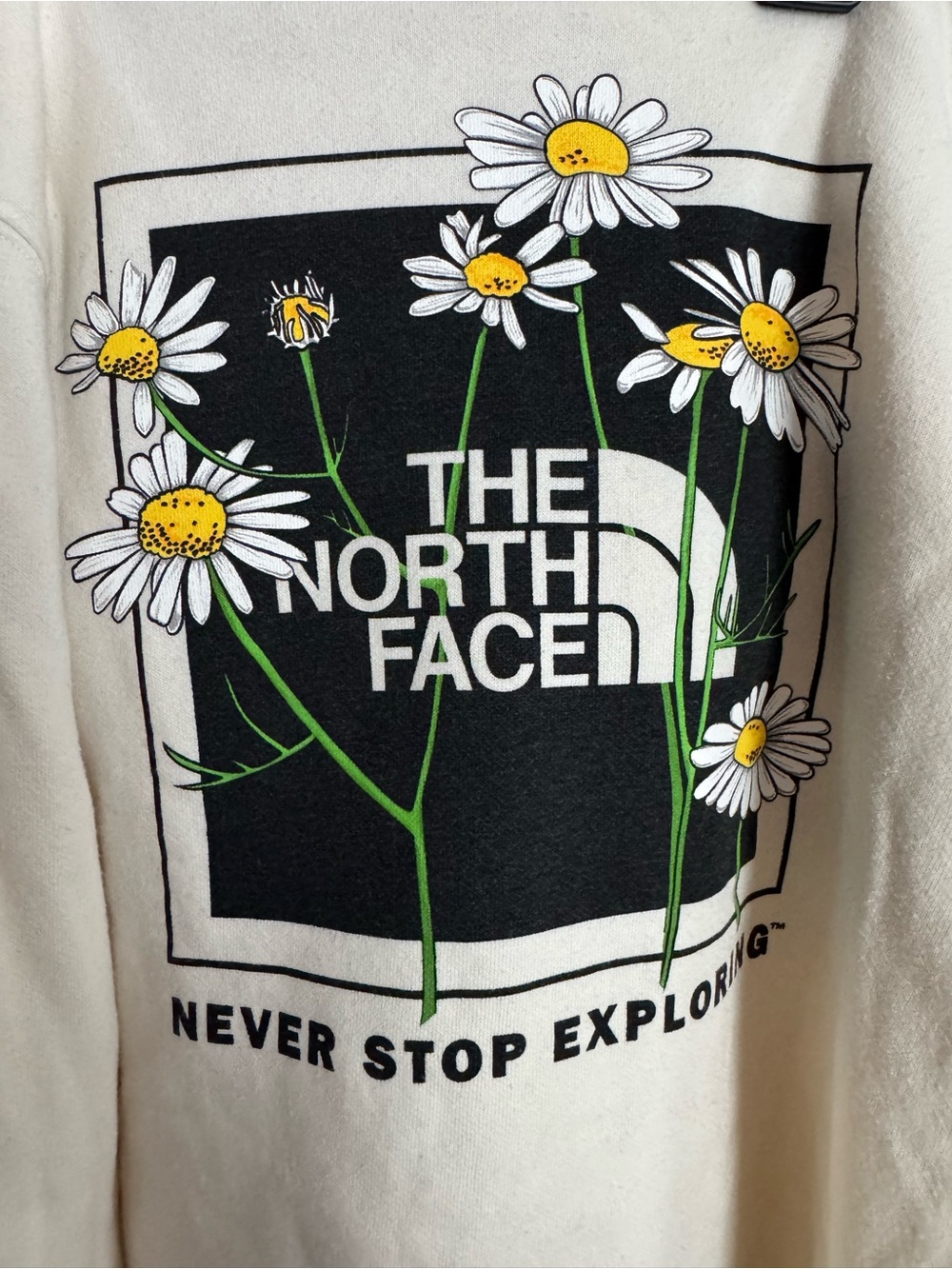 The North Face Cream Sweatshirt with Black Logo and Daisy Graphic